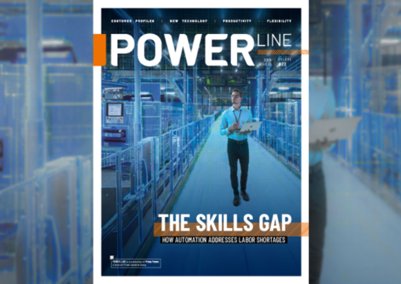 Magazine cover showing a person with a clipboard in a modern industrial facility.