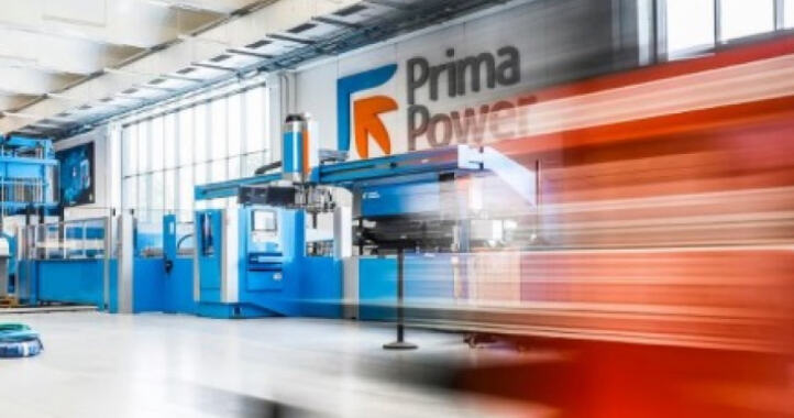 Bright modern factory floor with blue machinery and Prima Power logo on wall